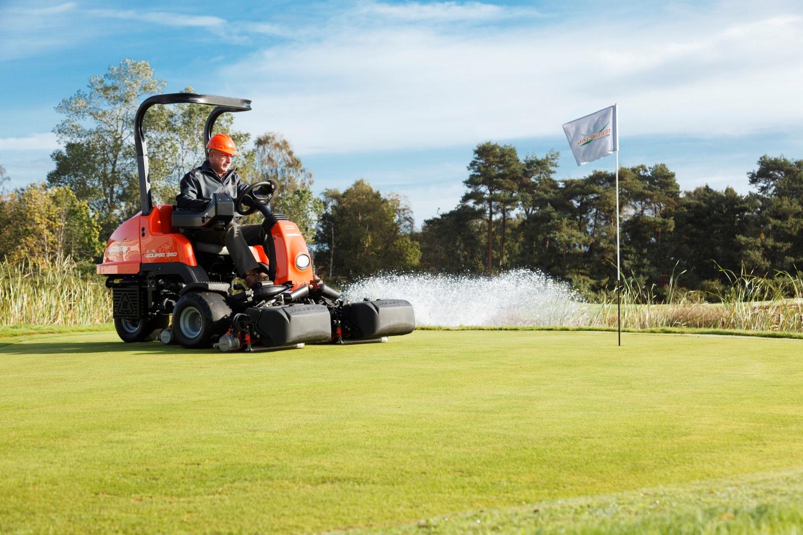 Mower spraying on grass